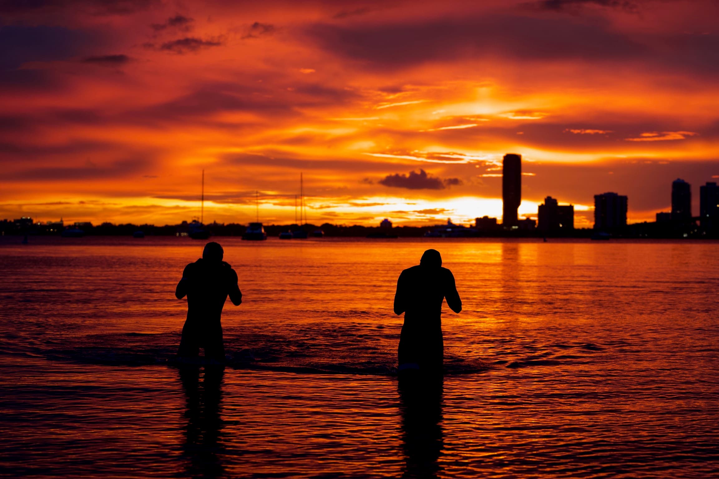 Athletes at sunset on the bay